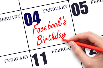 February 4. Hand writing text Facebook's Birthday on calendar date. Save the date.