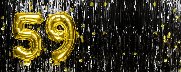 Gold foil balloon number number 59 on a background of black tinsel decoration. Birthday card,...