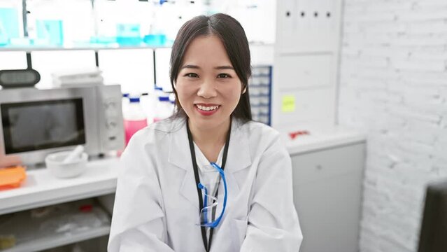 Young, Fun-lovin' Chinese Scientist Woman Pulling A Crazy Comical Fish Face In The Lab, Making Funny Expressions With Her Lips