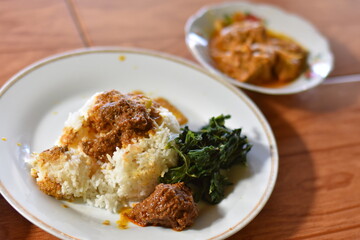 Nasi Padang with rendang is an Indonesian food from West Sumatra in Indonesia. Nasi Padang as favorites food for Indonesian people.


