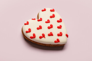 Heart shaped cookie on lilac background. Valentine's day celebration