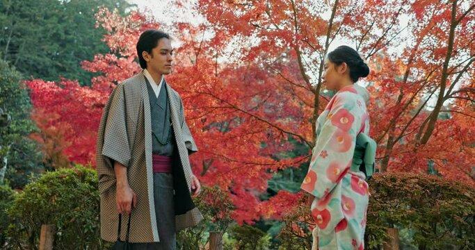 People in park in Japan, bow and traditional clothes with hello, nature and sunshine with respect and culture. Couple outdoor together in garden, greeting with modesty and tradition, polite and kind