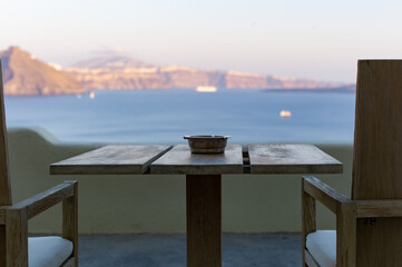 a table for two with ash tray on it at caldera cliff hotel santorini aegean sea greece