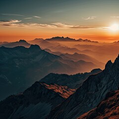 The sun is rising over a mountain range