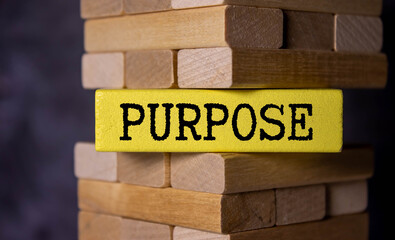 purpose word written on wood block. purpose text on table, concept