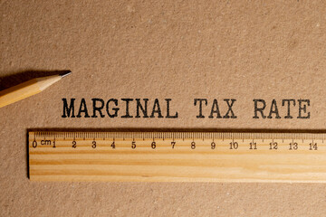 Financial concept meaning Marginal Tax Rate with phrase on the piece of paper