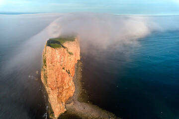 Aerial Drone Image at Dusk and sunset over Perce Rock on the St Lawrence in the eastern Maritime...