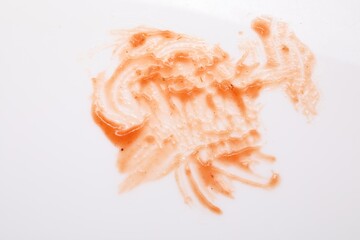 Smear of sauce on white background, top view