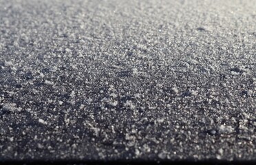 Close up of icy and snowy surfaces.