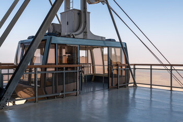 Empty cable car waiting at the platform for riders to board and descend from Masada in Israel.
