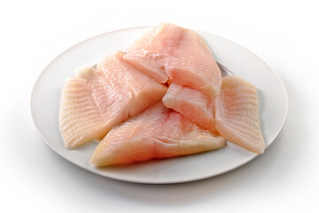 Round white plate with raw fish fillets