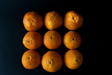 orange fruit on black background