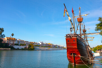 Historical wooden boat on the Guadalquivir river in Seville, Spain