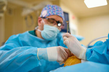 Plastic surgeons work in the operating room