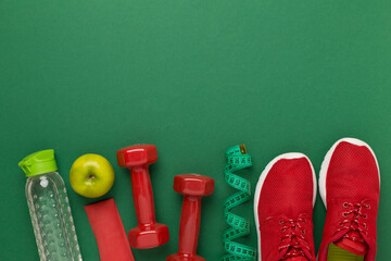 Sport equipment with tape measure on color background, top, view. Weight loss concept