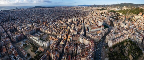 Aerial around downtown Barcelona on a sunny day in early spring