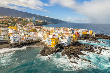 Aerial view of the beautiful oceanside town of Punta Bravo at sunrise, Tenerife