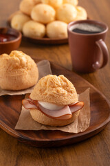 Cheese bread sandwich. Turkey slice and requeijão (Brazilian cream cheese). Brazilian snack. Breakfast.