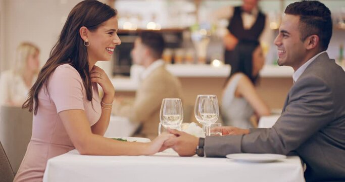Happy couple on date in restaurant with wine, holding hands and romantic evening together with fine dining service. Love, man and woman relax in luxury diner with smile, drinks and valentines day