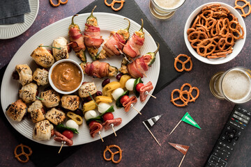 Top down view of a platter of game day appetizers with pretzels.