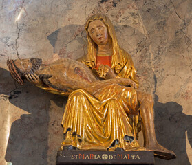 VIENNA - JULY 27: Pieta polychrome statue from Malta in side chapel of baroque church Maria Treu...