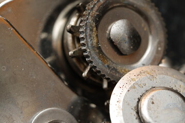 Close-up of mechanical gears showing intricate details and signs of wear