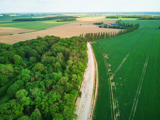 Aerial drone view of green fields and meadows in Yveliness,, near Paris, France