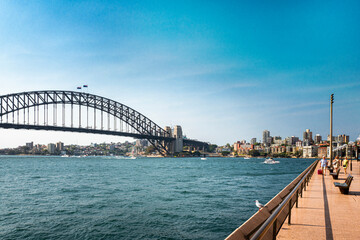The Sydney Harbor Bridge is a heritage-listed steel through arch bridge,  nicknamed The Coathanger...