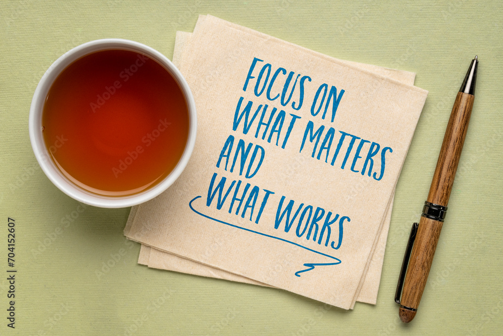 Sticker focus on what matters and what works - inspiraitonal writing on a napkin, productivity and priority 