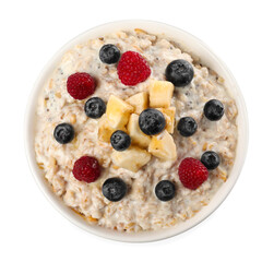 Tasty boiled oatmeal with berries and banana in bowl isolated on white, top view