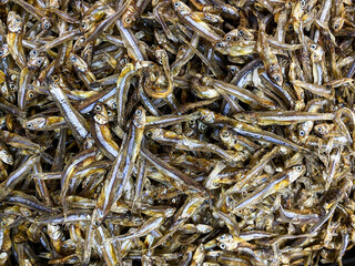 Beautiful top view of Dried anchovy texture background. Seafood in the market.