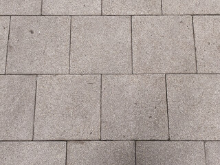 The abstract patterns on the rough wall create a visually interesting composition.