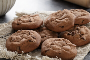 Close up of delicious chocolate chip cookies set on background