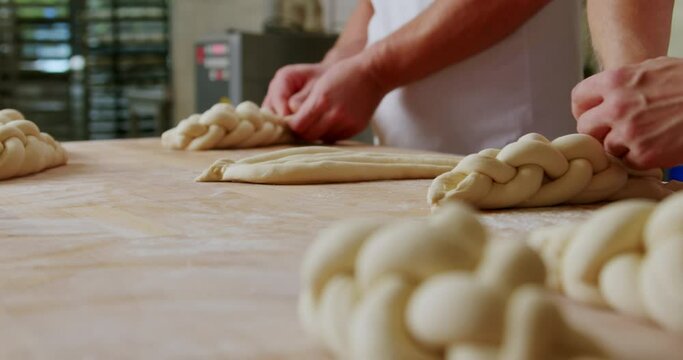 Making traditional challah pastries at a bakery, 4K, healthy home-made breakfasts, bakery and pastries, production of healthy food, traditional regional specialties, traditional Jewish festive bread