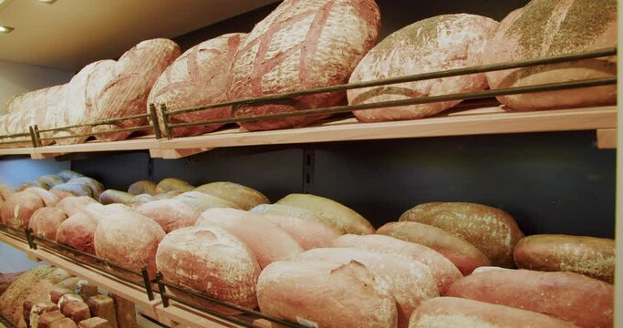 Shelf full of freshly baked bread in the bakery, 4K, healthy home-made breakfasts, bakery and pastries, production of healthy food, traditional regional specialties