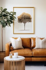 Brown leather couch with tree art