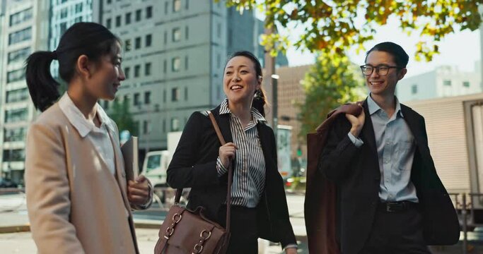 Asian, business people in city and travel, talking and walking with commute to work, conversation and bonding. Journey on urban street, friends chat with communication and happy commuting together