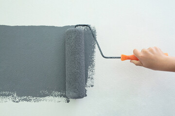 Roller Brush Painting, Worker painting on surface wall  Painting apartment, renovating with grey...
