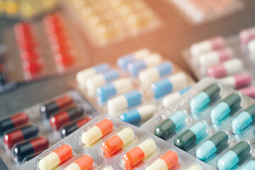 close up pharmaceuticals antibiotics pills medicine in blister packs. colorful antibacterials pills Pharmacy background. capsule pill medicine Antimicrobial drug resistance. Pharmaceutical industry - obrazy, fototapety, plakaty