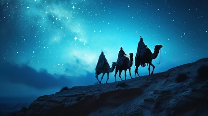 Foto op Plexiglas A silhouette of the Three Wise Men traveling on camels along the starlit path to reach Jesus at his birth. ©  creativeusman