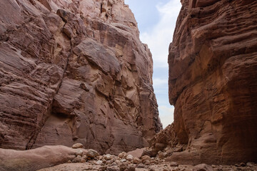 High  rocks with beautiful natural patterns at end of the hiking trail in Wadi Numeira gorge in Jordan