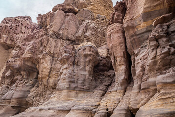 High  rocks with beautiful natural patterns at end of walking trail in Wadi Numeira gorge in Jordan