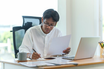 Young man freelancer working with computer laptop at home..