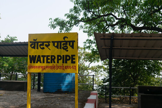 Picture of board of Water pipe railway station which is on the way of famous Matheran toy train. Tourism, passenger, tourism, people, selfies, photography, waterfalls
