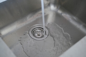 water pouring from a faucet tap slow motion 