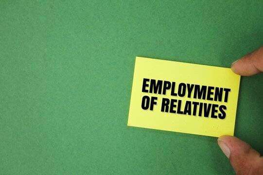 hand holding colored paper with the word Employment of relatives