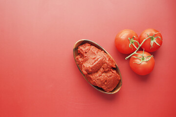 top view of Tomato paste with ripe tomatoes.