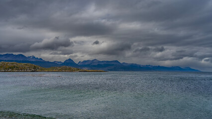 Beautiful seascape of Patagonia. Ripples on the turquoise water of the Beagle Canal. An island with...