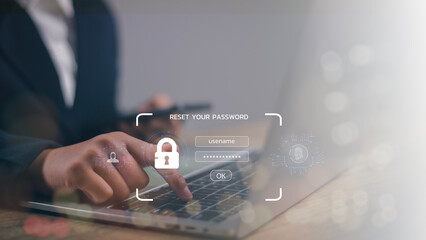  A lock icon, and security code show on the change password page while a business person using a laptop computer. Cyber security technology on websites or apps for data protection.
