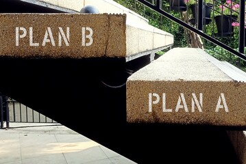 Stairs step with text inscription PLAN A - PLAN B , concept of strategy or plan to be implemented...
